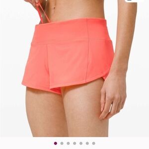 Lululemon Athletica Bright Coral Athletic Shorts.